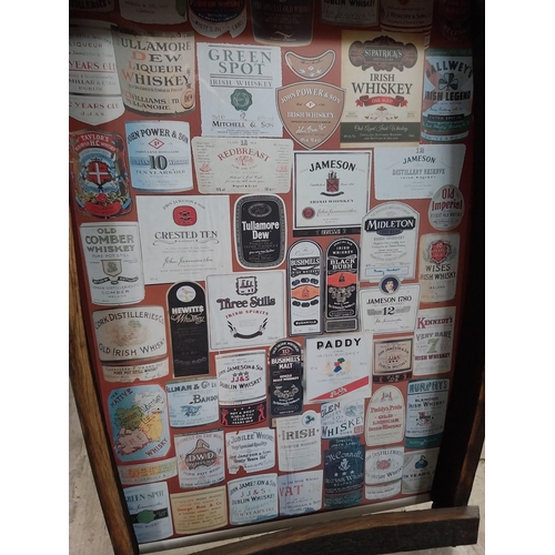 493 - Framed montage of Irish Whiskey labels. {92 cm H x 63 cm W x 11 cm D}.