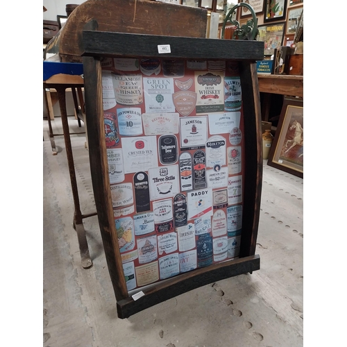 493 - Framed montage of Irish Whiskey labels. {92 cm H x 63 cm W x 11 cm D}.