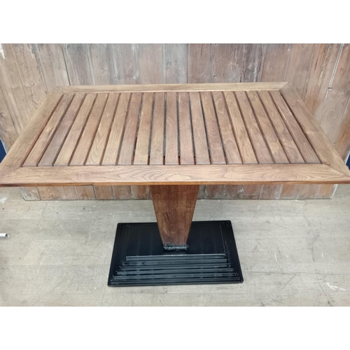 500 - Cast iron stepped drink stand high table with Iroka top and four iron high stools with leather seats... 