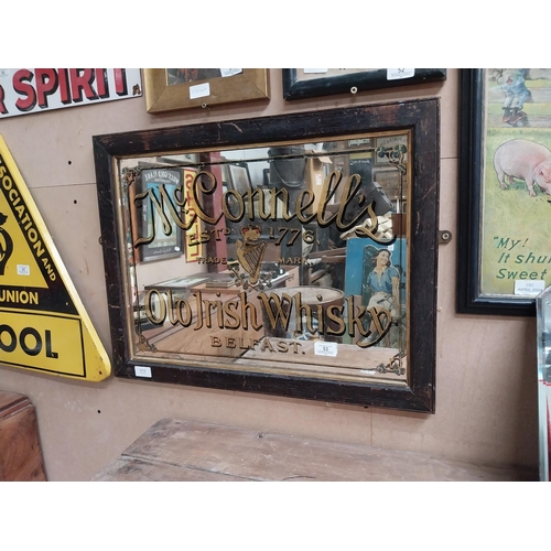 53 - McConnell's Old Irish Whisky Belfast framed advertising mirror. {43 cm H x 64 cm  W}.