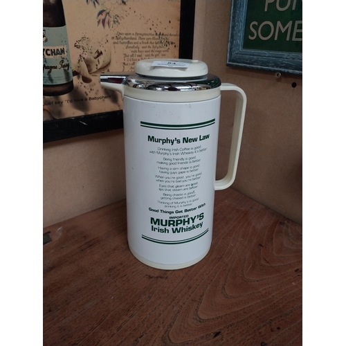 54 - Murphys Irish Whiskey flask. {27 cm H x 18 cm Dia.}.