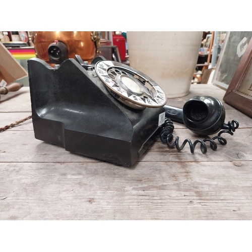 551 - 1940's Bakelite telephone. {15 cm H x 15 cm W x 20 cm D}.