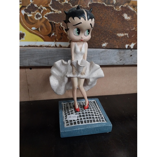 568 - Betty Boop advertising figure on stand. {27 cm H x 17 cm W x 17 cm D}.