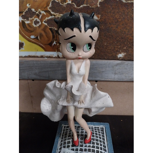 568 - Betty Boop advertising figure on stand. {27 cm H x 17 cm W x 17 cm D}.