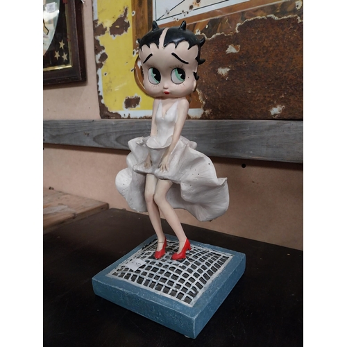 568 - Betty Boop advertising figure on stand. {27 cm H x 17 cm W x 17 cm D}.