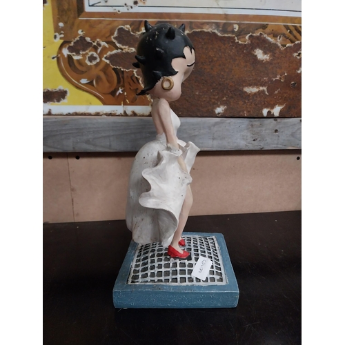 568 - Betty Boop advertising figure on stand. {27 cm H x 17 cm W x 17 cm D}.