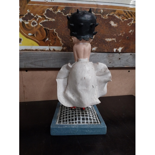 568 - Betty Boop advertising figure on stand. {27 cm H x 17 cm W x 17 cm D}.