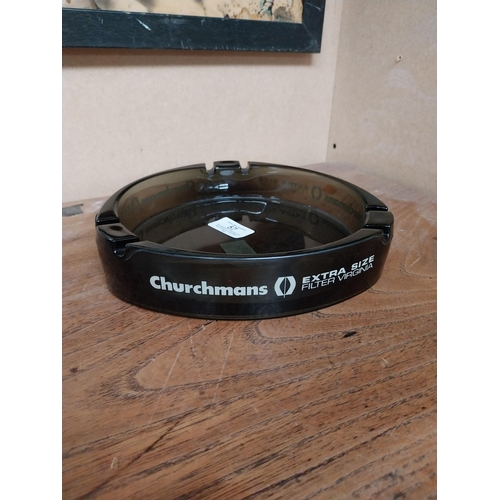 57 - Churchman's Extra Size glass advertising ashtray. {4 cm H x 21 cm Dia.}.