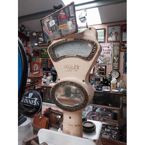 578 - 1930's enamel and brass Henry Pooley and Son Birmingham shop scales. {98 cm H x 28 cm W x 58 cm D}.