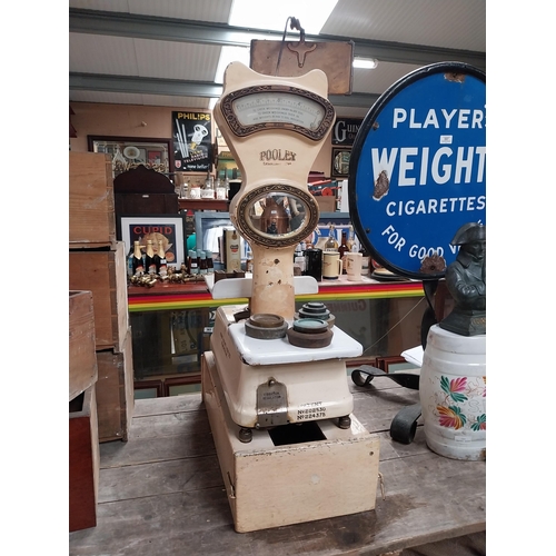 578 - 1930's enamel and brass Henry Pooley and Son Birmingham shop scales. {98 cm H x 28 cm W x 58 cm D}.