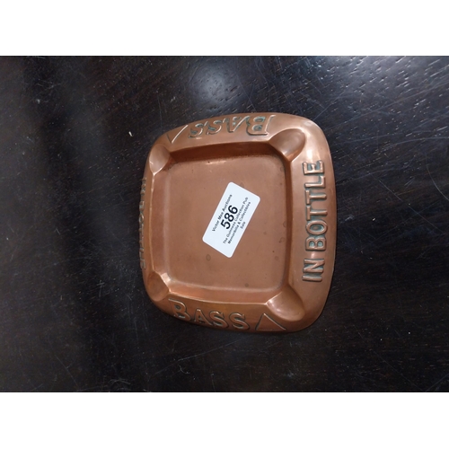 586 - Two 1930's copper Bass ashtrays. {12 cm W x 12 cm D}.