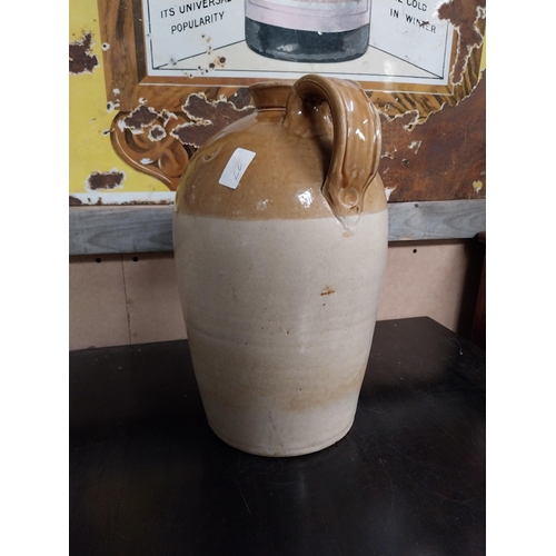 589 - L Egan North King Street Dublin Two gallon stoneware whiskey flagon. {49 cm H x 32 cm Dia.}.