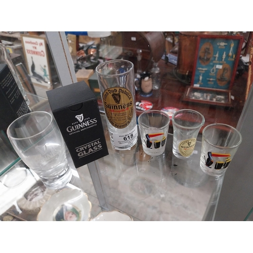 618 - Four Guinness shot glasses and Guinness glass in box. PART OF THE DAVID HUGHES COLLECTION.