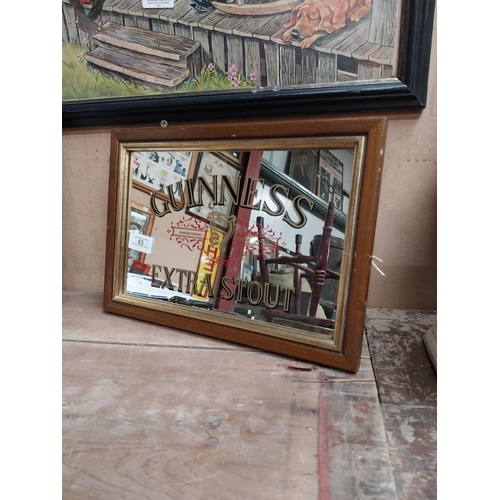 63 - Framed 1970's Guinness Extra Stout advertising mirror. {24 cm H x 34 cm W}.