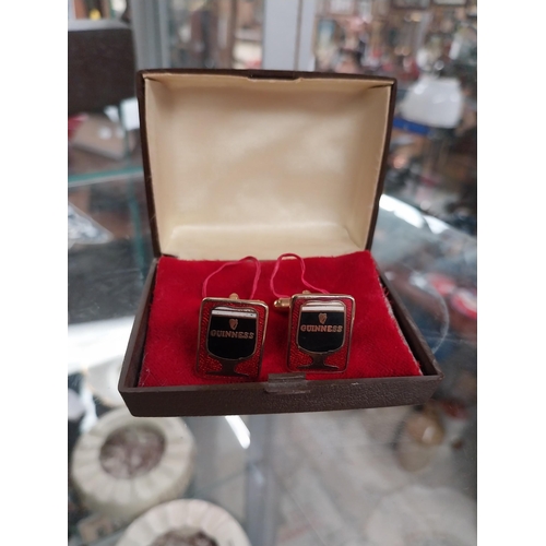 641 - Two sets of Guinness cuff links - Guinness on red background and Guinness Glasses with label on reve... 