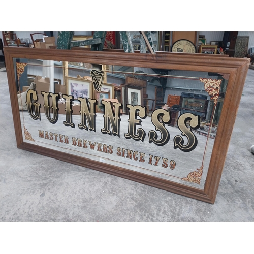 666 - 20th C. Guinness Master Brewers since 1759 framed advertising mirror {86 cm H x 167 cm W}.