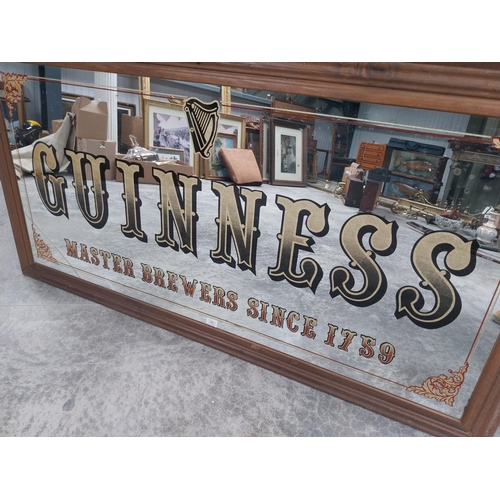 666 - 20th C. Guinness Master Brewers since 1759 framed advertising mirror {86 cm H x 167 cm W}.