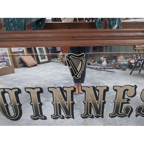 666 - 20th C. Guinness Master Brewers since 1759 framed advertising mirror {86 cm H x 167 cm W}.