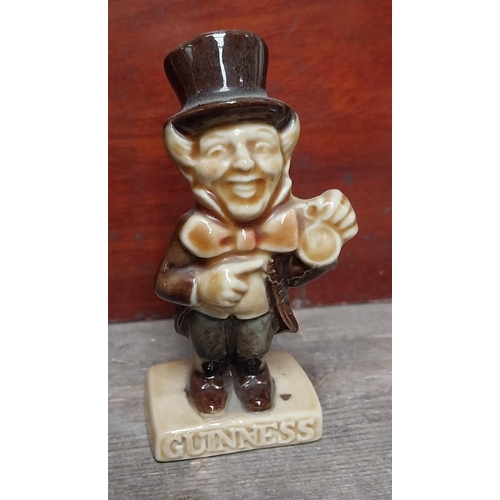 685 - Set of four Wade Pottery Guinness figures - Wellington, Sam Weller, Mad Hatter and Tweedledum/Tweedl... 