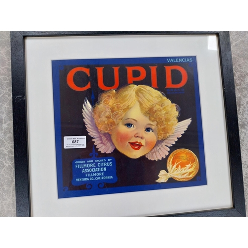 687 - Cupid Sunkist framed advertising print. {28 cm H x 40 cm W}.