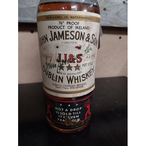 693 - Bottle of John Jameson Dublin Irish Whiskey  Not a Drop sold til its seven years old label attached.