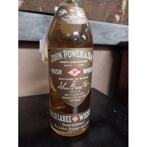 695 - Bottle of John Powers and Son Whiskey.