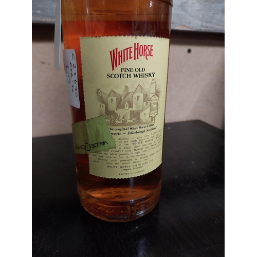 697 - Bottle of White Horse Scotch Whiskey.