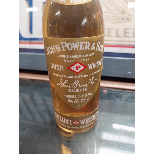 698 - Three half bottles of John Powers and Sons Whiskey.