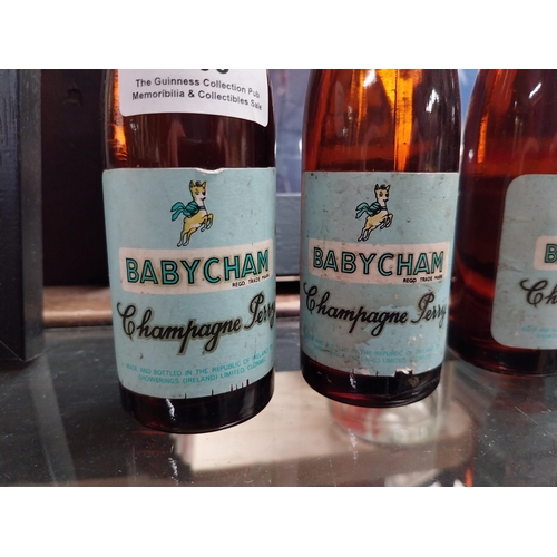 705 - Six bottles of Babycham.