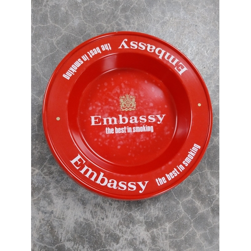 713 - Two plastic Embassy Cigarettes ashtrays. {3 cm H x 21 cm Dia}.