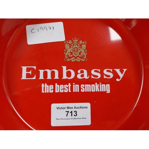 713 - Two plastic Embassy Cigarettes ashtrays. {3 cm H x 21 cm Dia}.