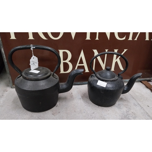 718 - Two 19th C. metal kettles. {23 cm H x 30 cm Dia.} and {18 cm H x 24 cm Dia.}.