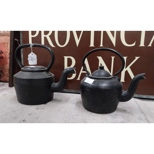 718 - Two 19th C. metal kettles. {23 cm H x 30 cm Dia.} and {18 cm H x 24 cm Dia.}.