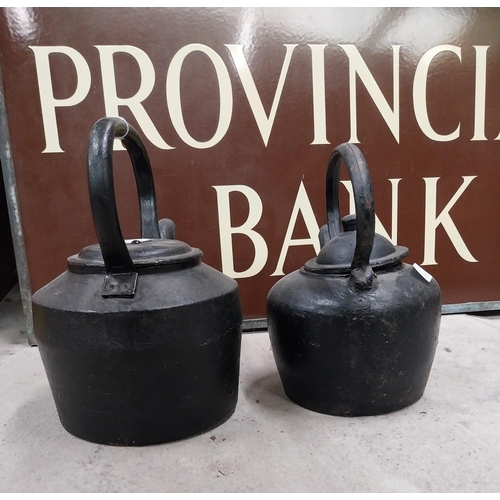 718 - Two 19th C. metal kettles. {23 cm H x 30 cm Dia.} and {18 cm H x 24 cm Dia.}.