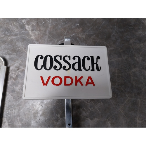 733 - Two optics - Cossack Vodka and John Barr {36 cm H x 13 cm W  x 14 cm D}.