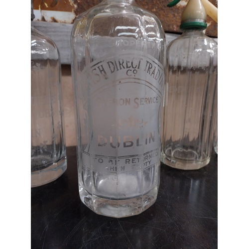 741 - Four Dublin Mineral Water glass siphons - Irish Direct Trading Dublin. {30 cm H x 10 cm Dia.}