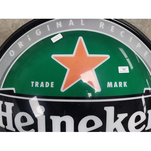 743 - Heineken Perspex half advertising sign. {76 cm Dia.}.