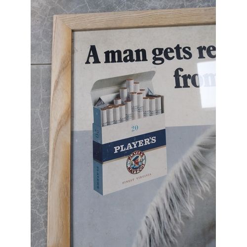 746 - Framed A Man Gets Real Pleasure From Player's advertising showcard. {82 cm H x 57 cm W}.