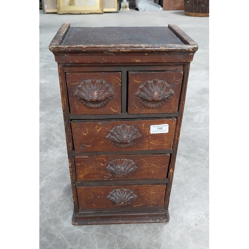 748 - 19th C. scumbled pine shop cabinet with two short drawers over three long drawers with carved wooden... 