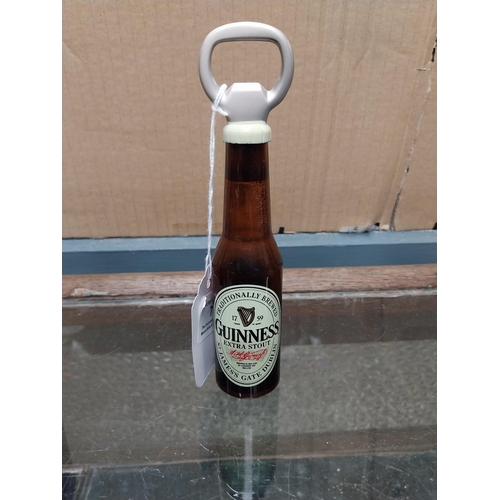 752 - Guinness Bottle openers in shape of Guinness Bottles (one white plastic with bottle printed in black... 