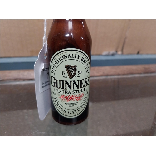 752 - Guinness Bottle openers in shape of Guinness Bottles (one white plastic with bottle printed in black... 