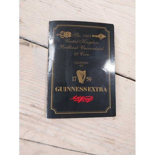 758 - 1989 Guinness �2 coin and Video 40 Years of Guinness. PART OF THE DAVID HUGHES COLLECTION.