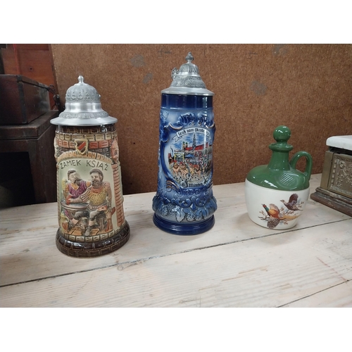 766 - Two German ceramic Beer steins {27 cm H x 10 cm Dia.} and stoneware flagon {18 cm H x 10 cm Dia.}.