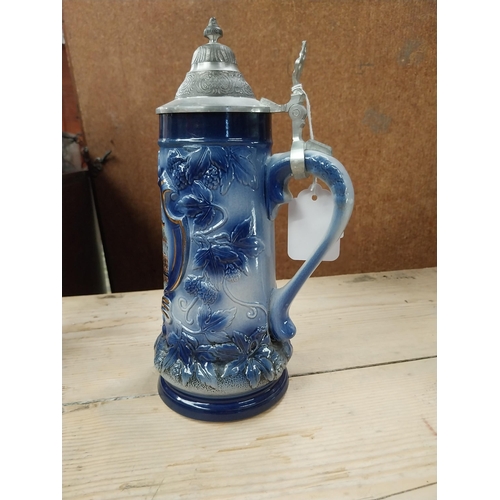 766 - Two German ceramic Beer steins {27 cm H x 10 cm Dia.} and stoneware flagon {18 cm H x 10 cm Dia.}.