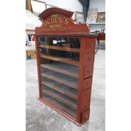 776 - Ogden's cigarettes dispensing advertising cabinet with seven pull out brand name drawers {H 77cm x W... 