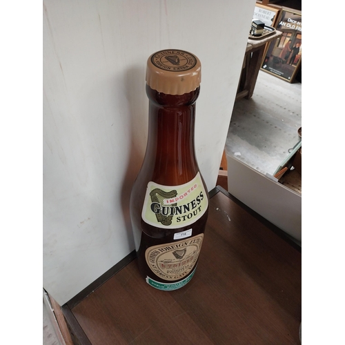 778 - Rare glass Guinness display bottle {66 cm H x 17 cm Dia.}.