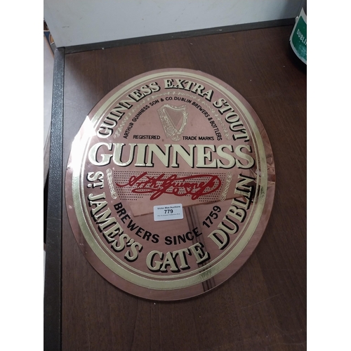 779 - Guinness Extra Stout advertising mirror. {29 cm H x 30 cm W}.