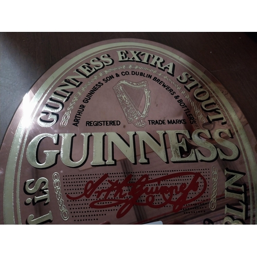 779 - Guinness Extra Stout advertising mirror. {29 cm H x 30 cm W}.