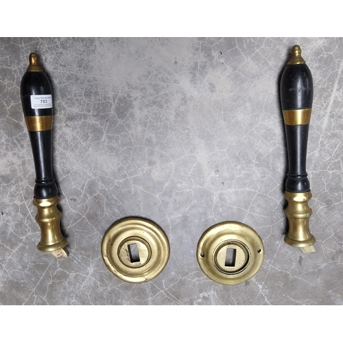 783 - Pair of early 20th C. brass and ebony bar pulls. {35 cm H}.