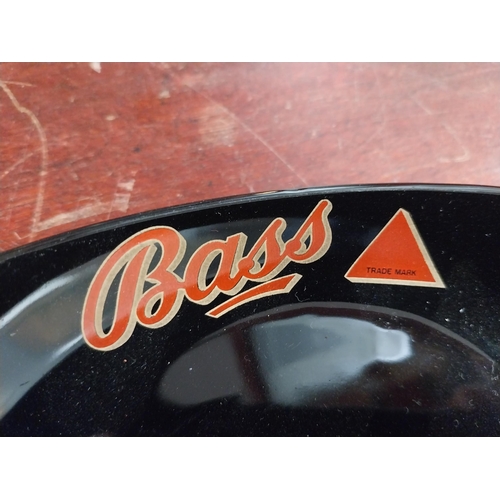 784 - Bass Wade ashtray {3 cm H x 16 cm W x 15 cm D} and Harp ashtray {3 cm H x 16 cm W x 9 cm D}.